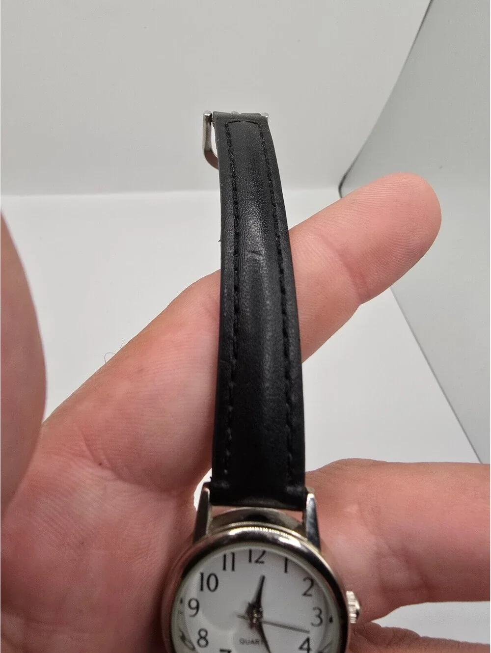 Accutime Quartz Analog Wristwatch White Dial Arabic Numerals Silver Case 26mm